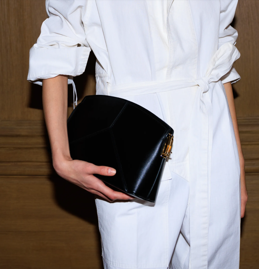 An oversized leather clutch bag with a simple yet elegant design, offering ample space and style.