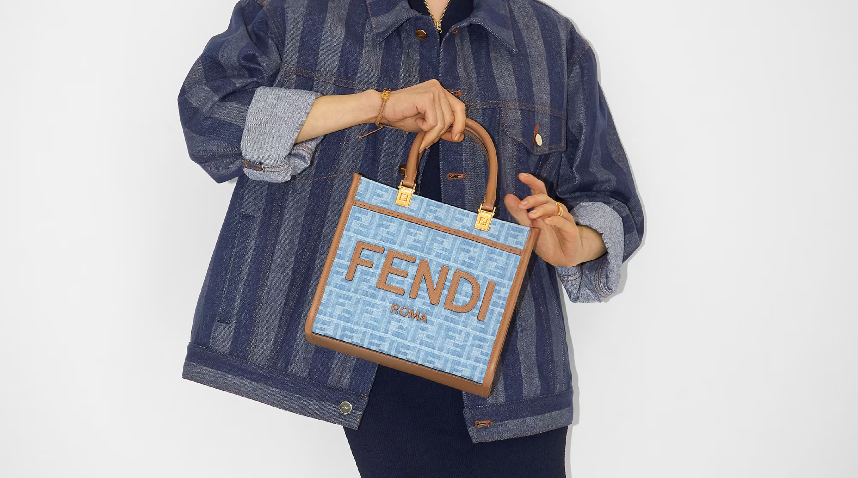 A stylish classic Fendi handbag featuring the iconic Fendi monogram pattern, perfect for adding a touch of luxury to any outfit.