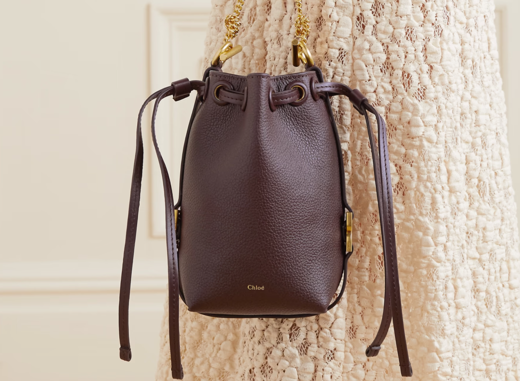  stylish 2024 bucket bag with a quilted leather design, featuring gold-tone hardware and a drawstring closure, perfect for adding a touch of luxury to any outfit.